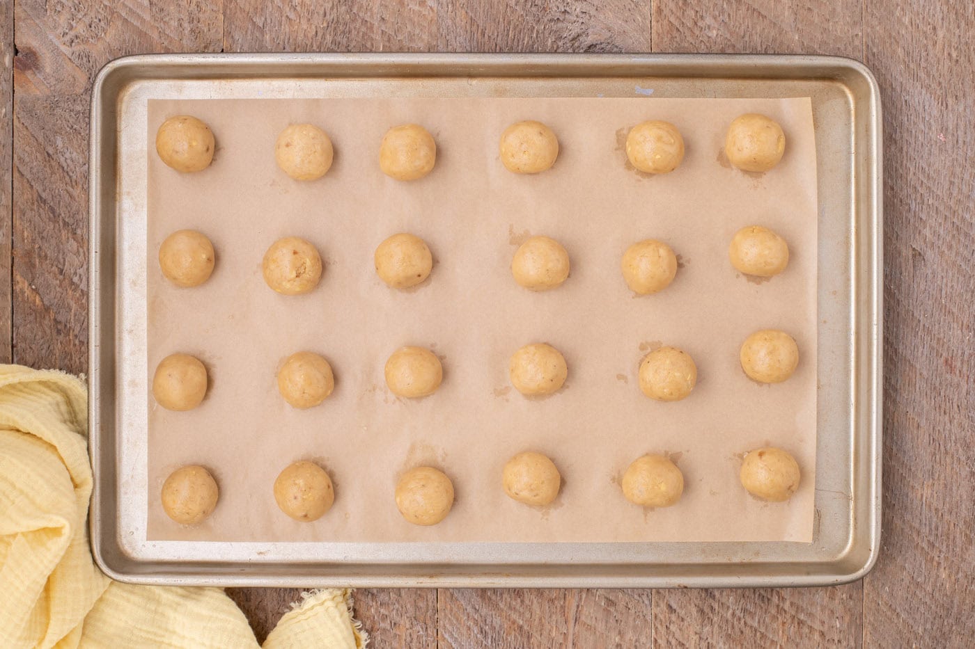 banana truffles on a parchment lined baking sheet