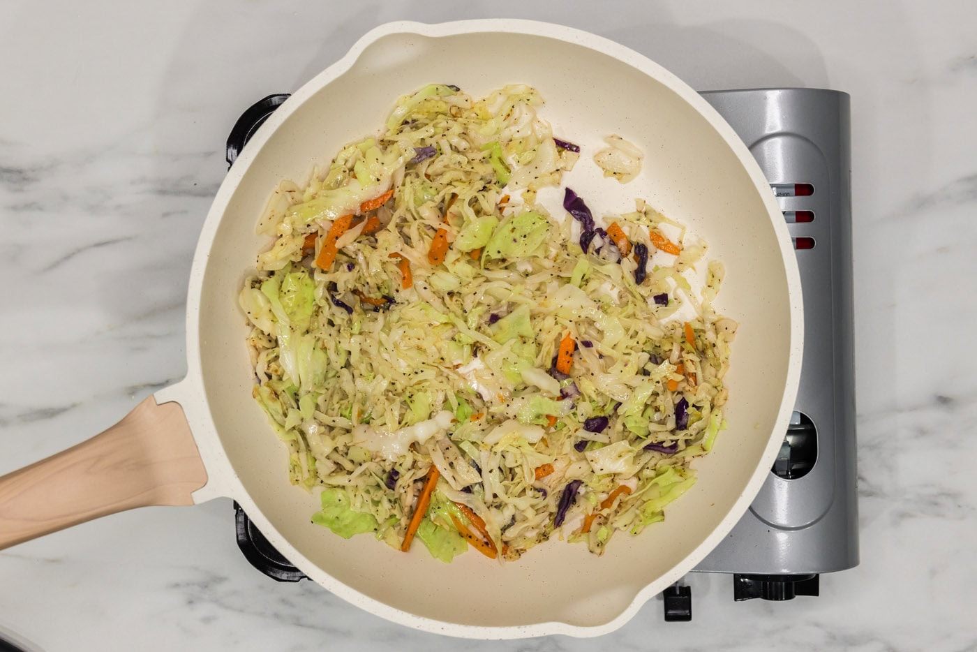 sauteed coleslaw in a skillet