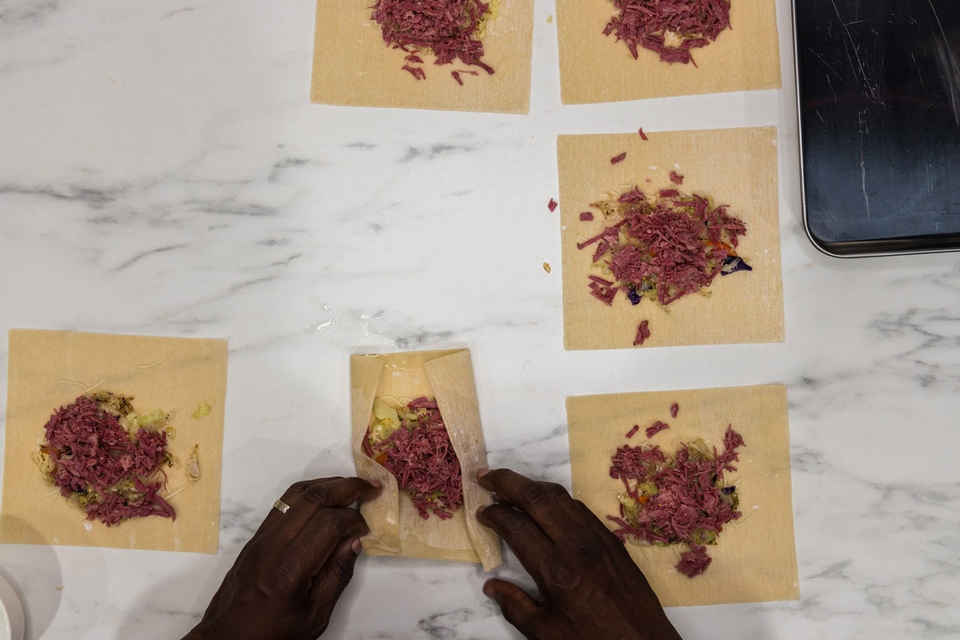 wrapping egg rolls with filling