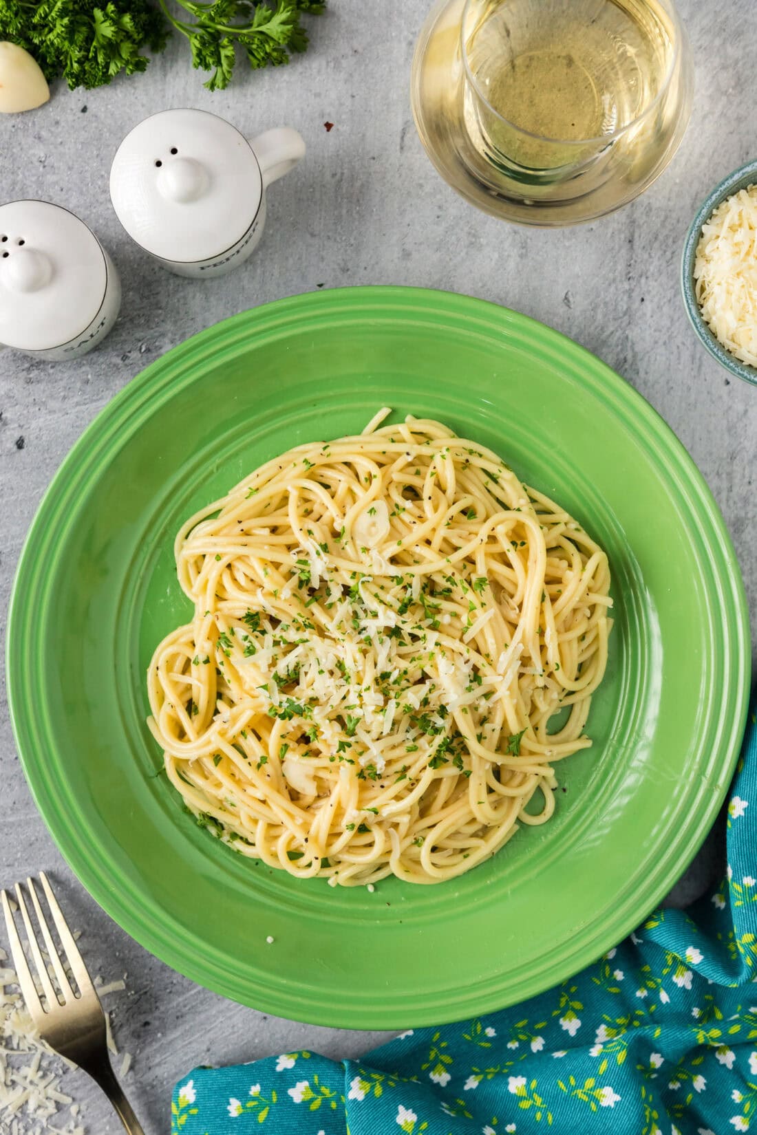 Serving of Garlic Butter Pasta on a plate topped with parmesan and parsley