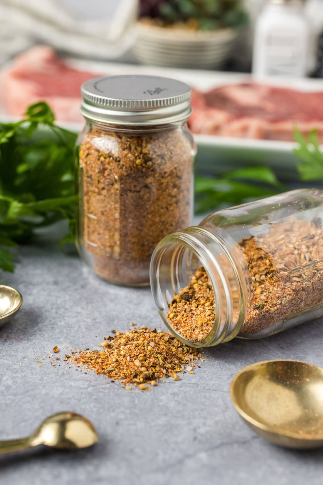 Spice jars filled with Homemade Montreal Steak Seasoning