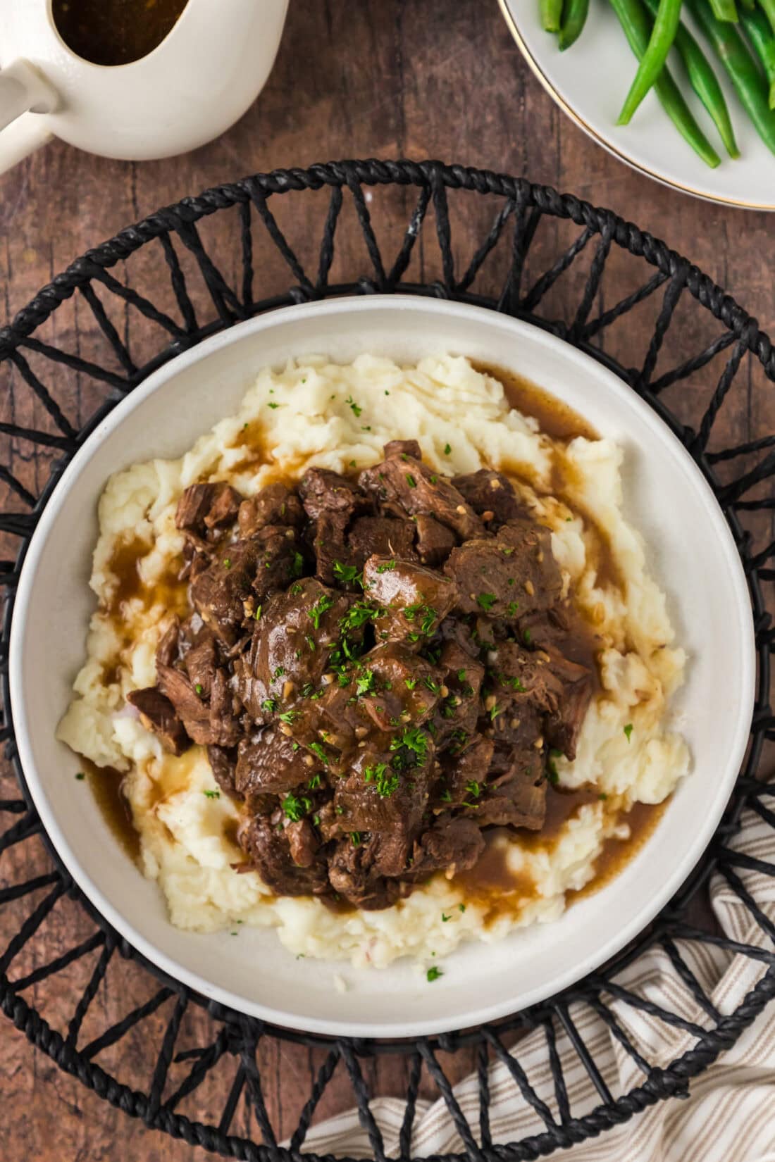 Overhead photo of Instant Pot Beef Tips and Gravy served over mashed potatoes