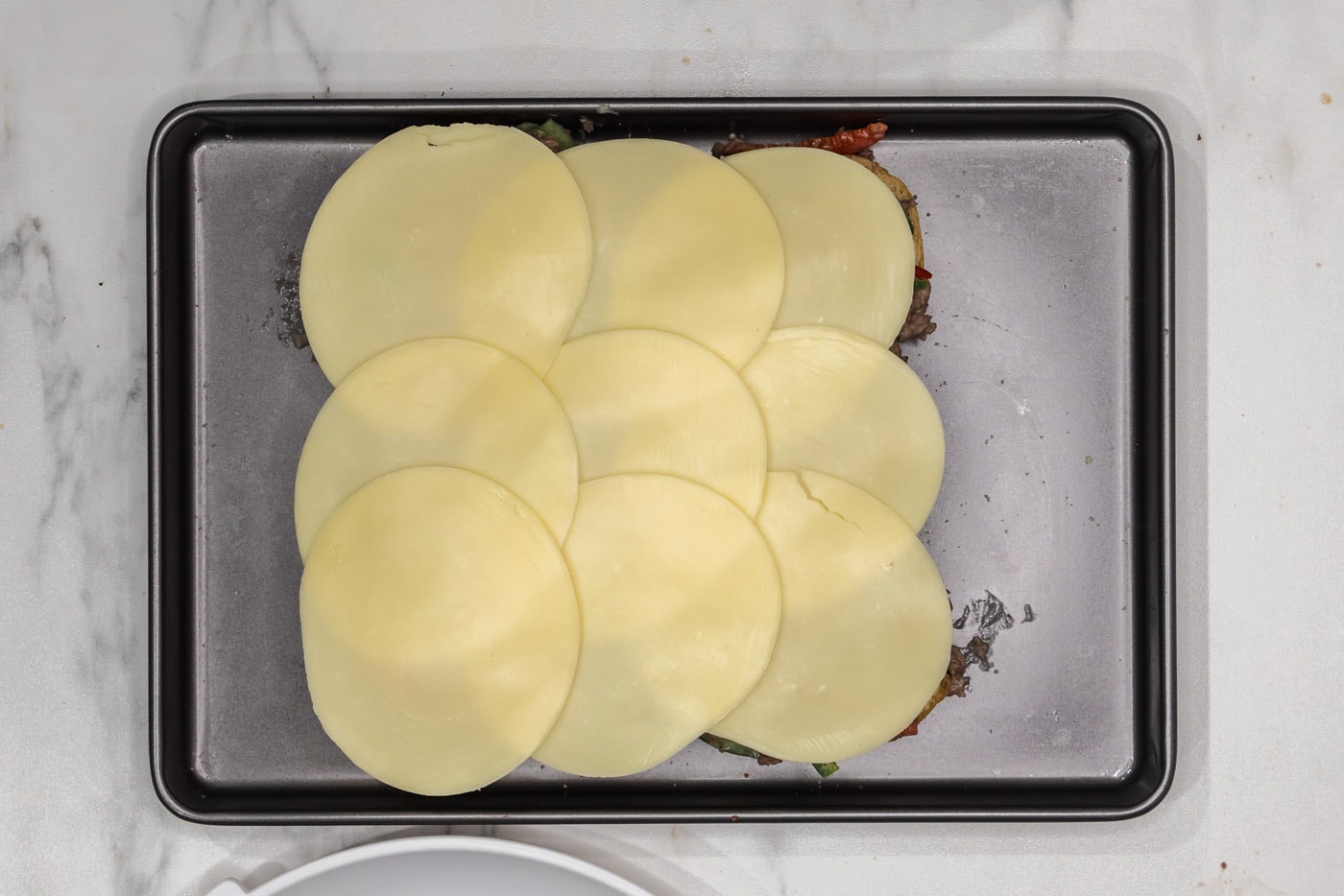 provolone cheese on top of beef sliders