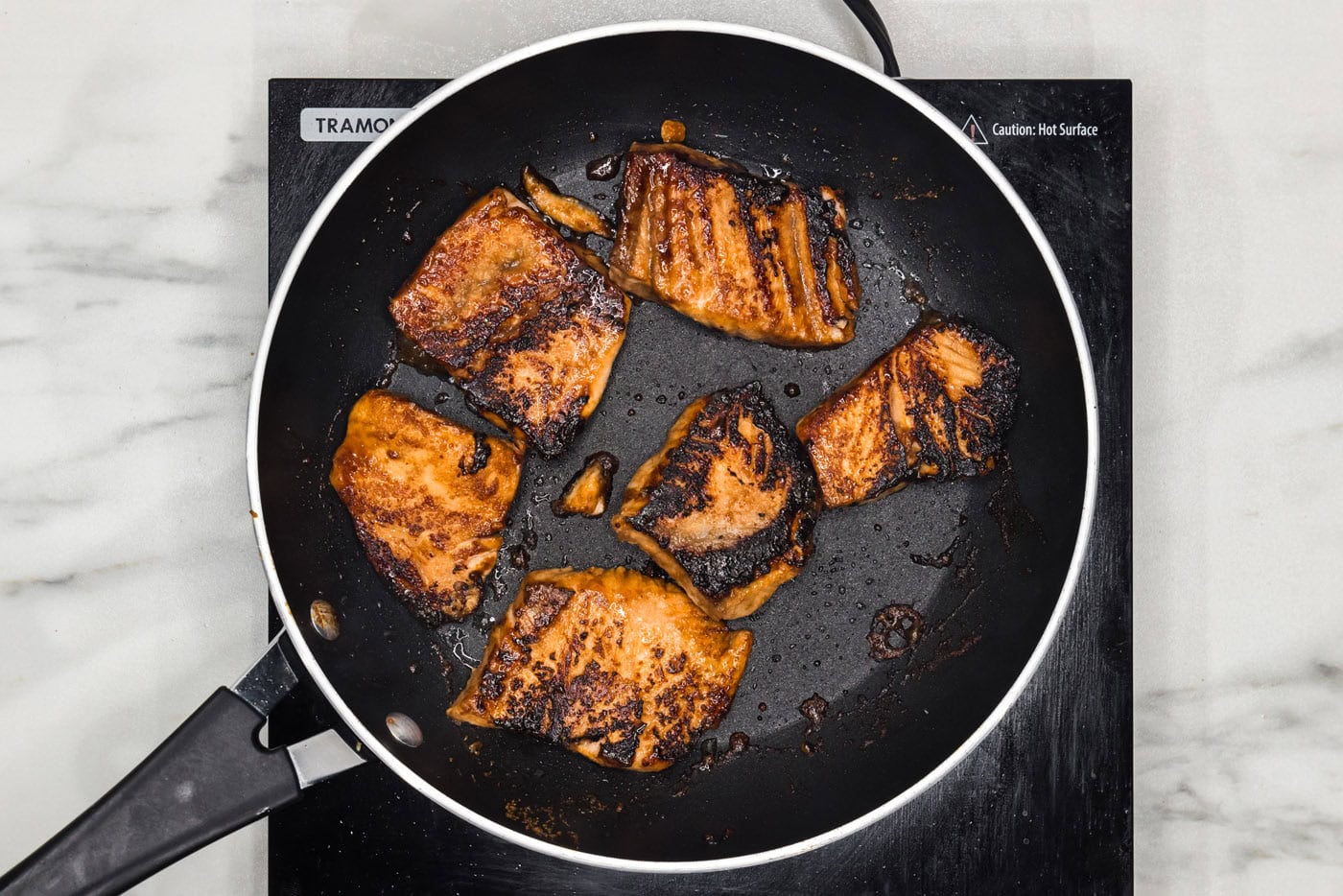 cooked salmon in a skillet