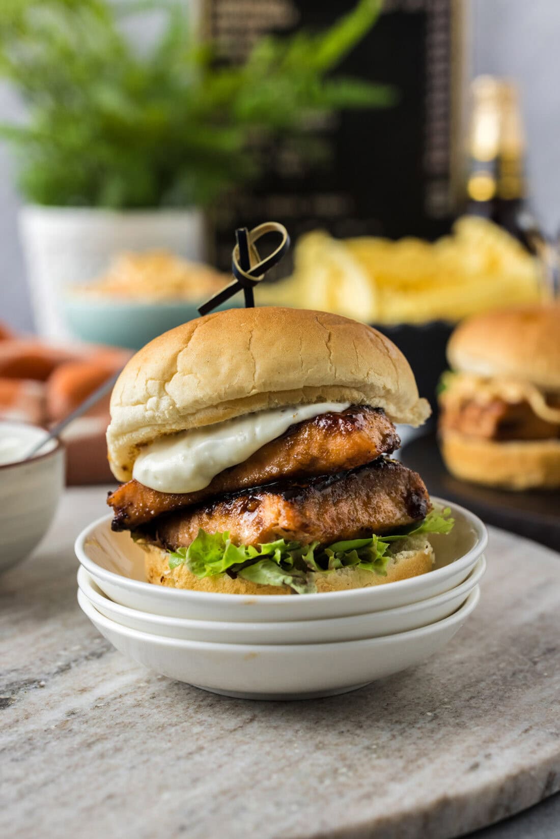 Salmon Slider on a stack of plates