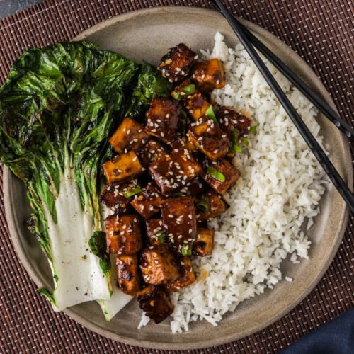 Overhead photo of a plate of Spicy Tofu, rice, and chopsticks