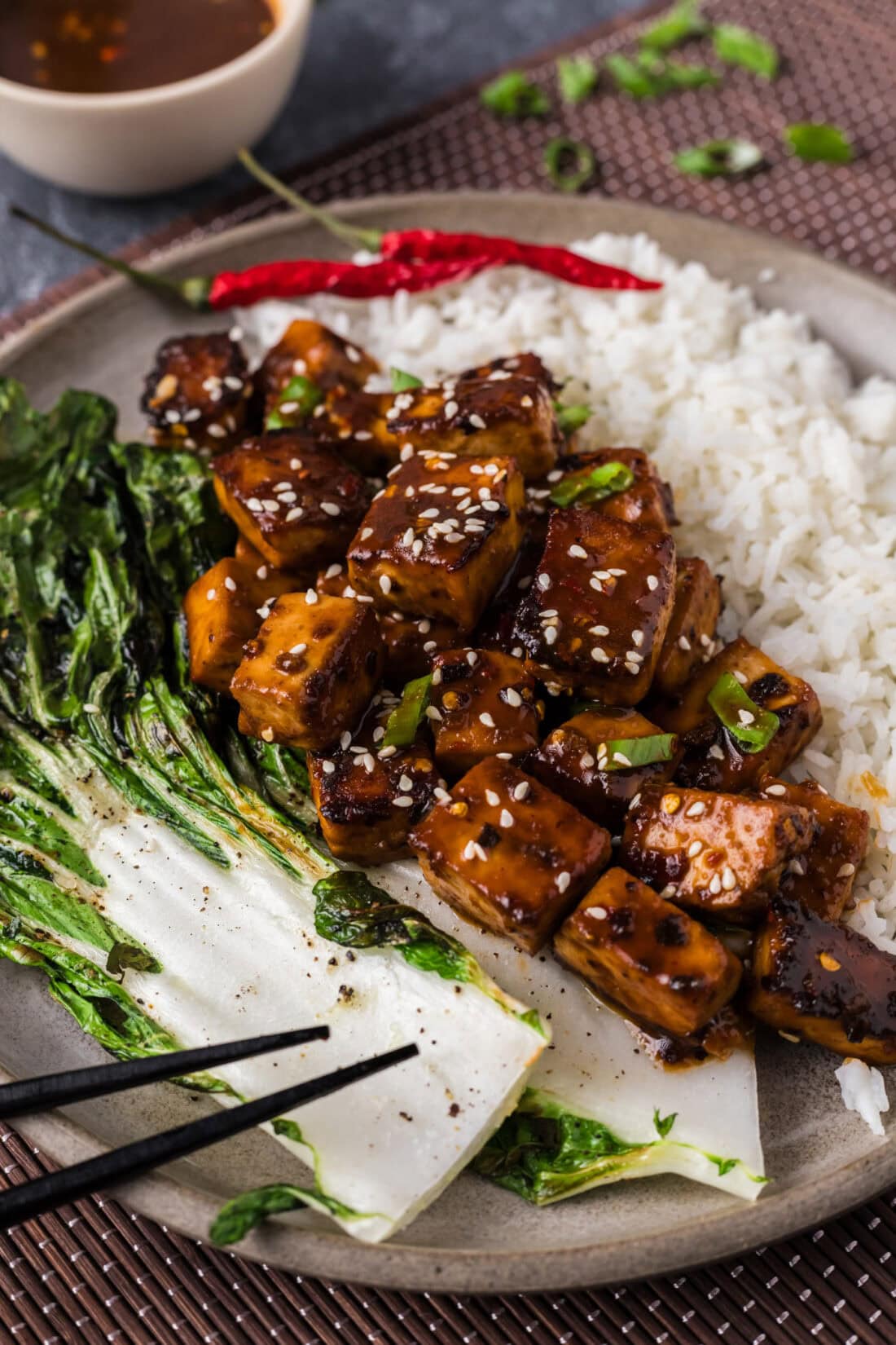 Spicy Tofu on a plate topped with sesame seeds