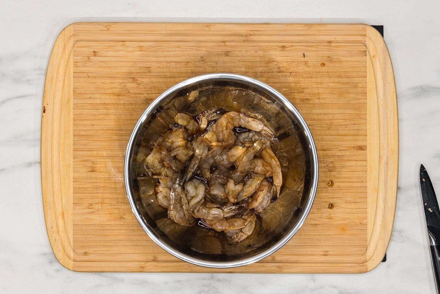 shrimp in a bowl with soy sauce and maple syrup glaze