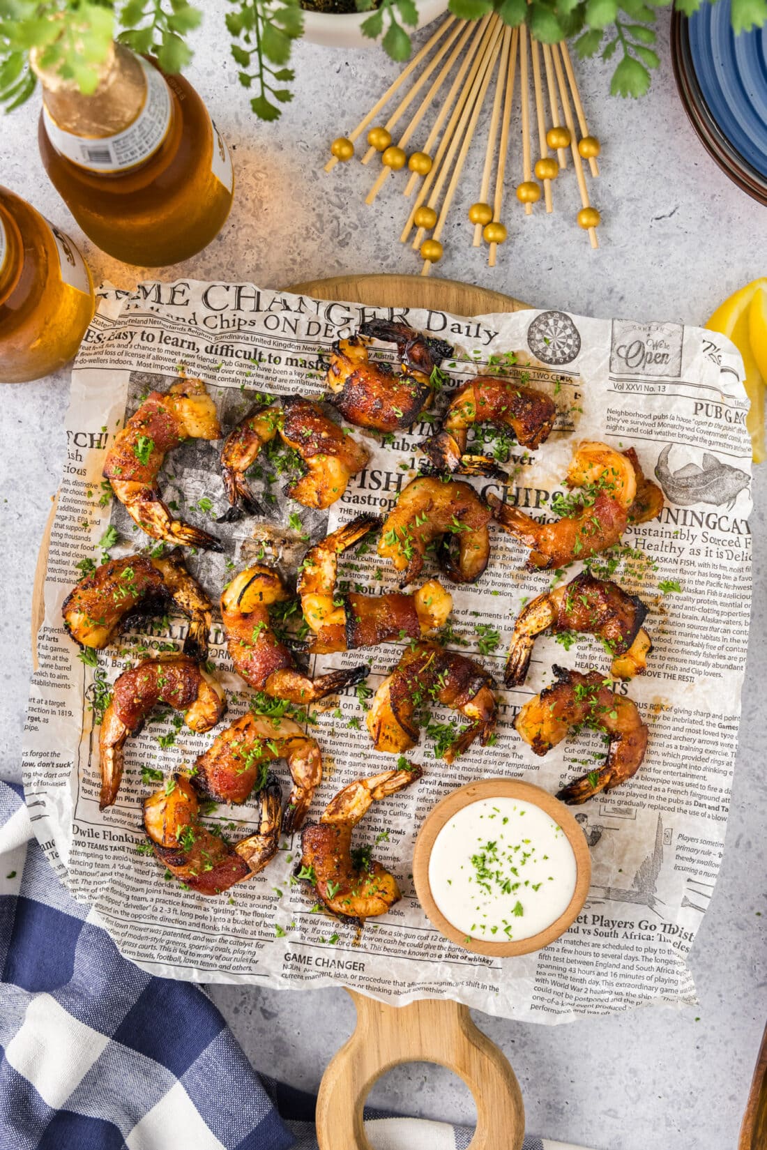 Air Fryer Bacon Wrapped Shrimp on a parchment lined board