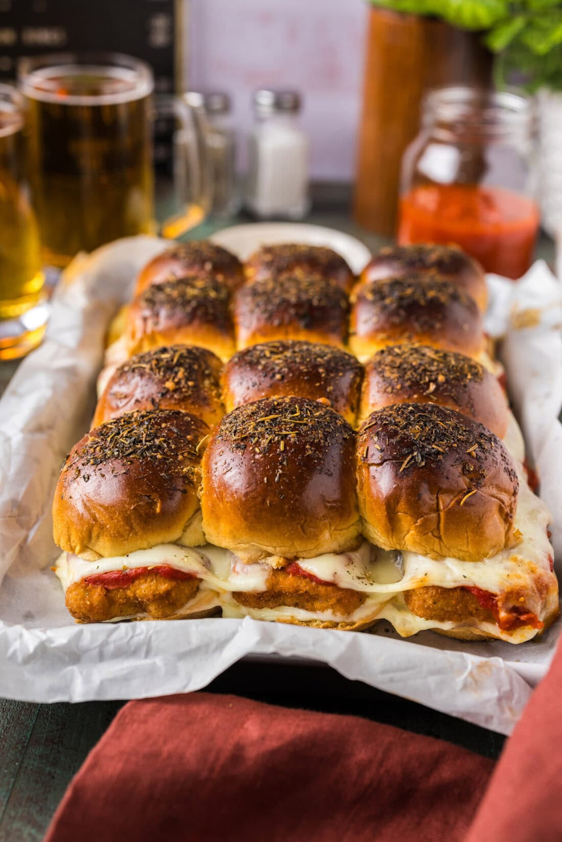 Chicken Parmesan Sliders in a parchment lined pan