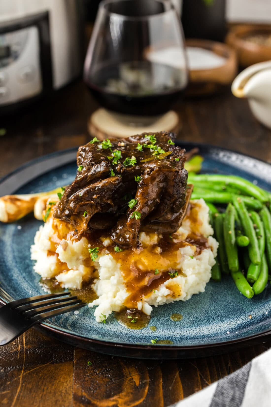 Crockpot Beef Short Rib on top of mashed potatoes 