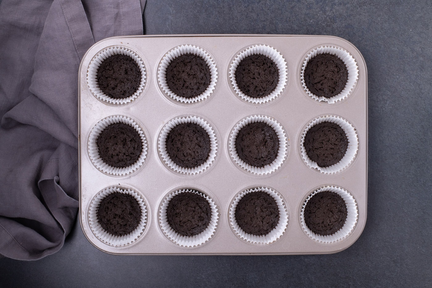 Oreo cookie crust inside cupcake liners