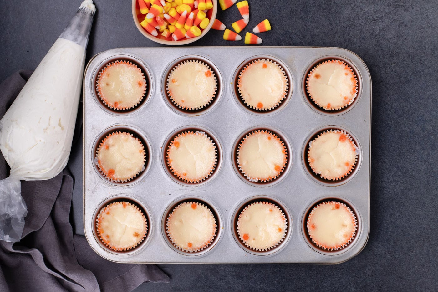 cooled mini candy corn cheesecakes in a cupcake pan