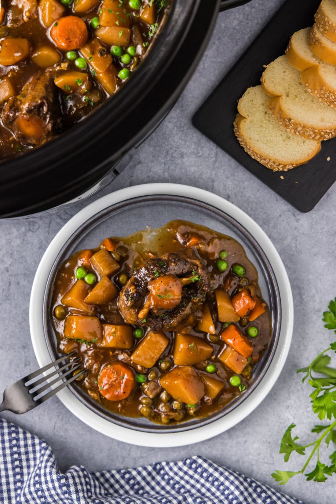 Slow Cooker Oxtail on a plate with a fork