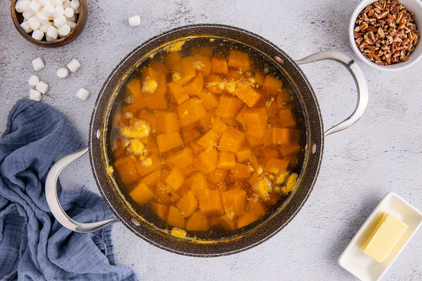 cubed sweet potatoes boiling in water