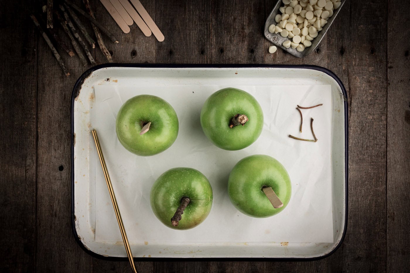 apples with a skewer stuck in them