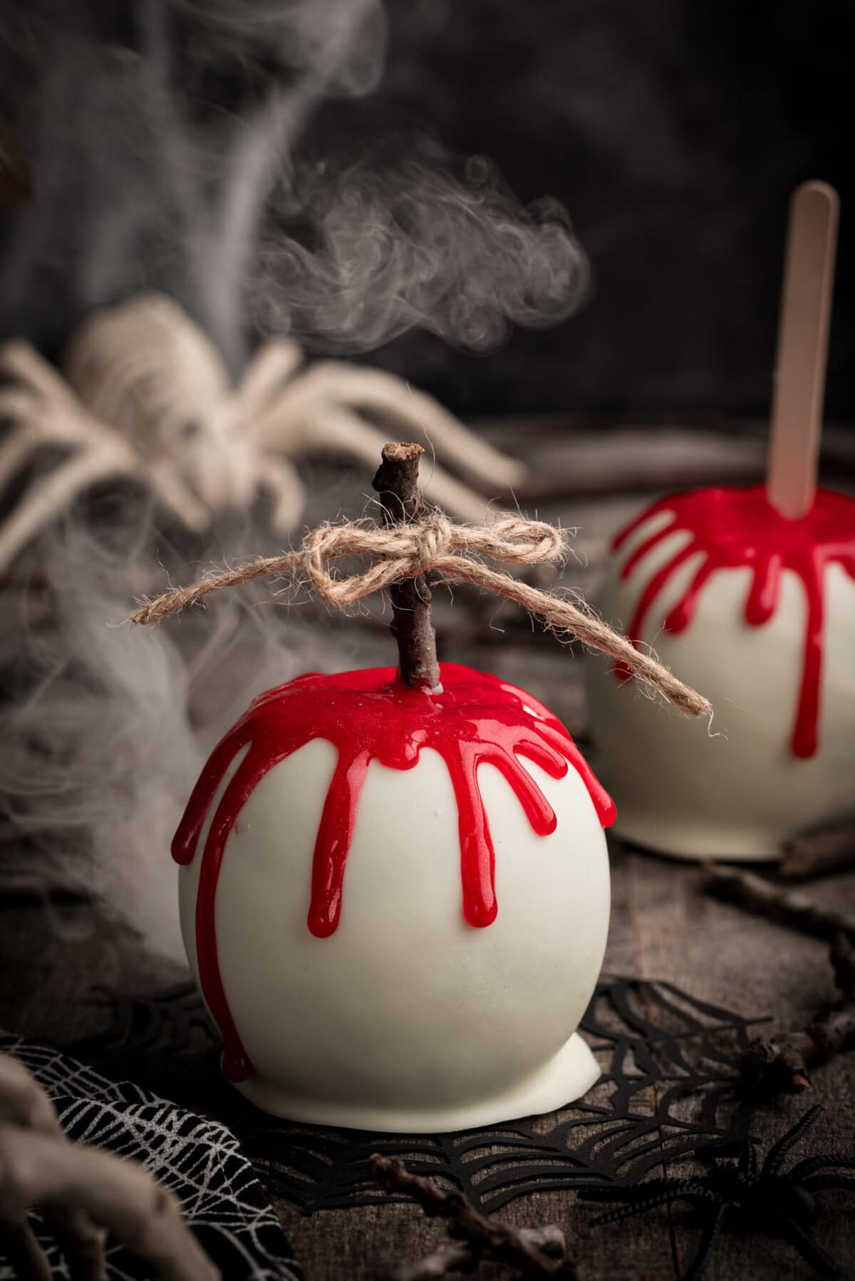 Bloody Candy Apple with smoke behind it