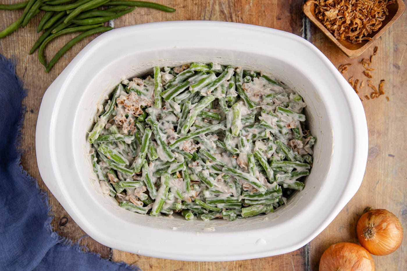 green bean casserole in a slow cooker crock