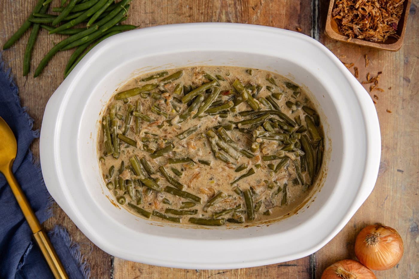 cooked green bean casserole in a crockpot