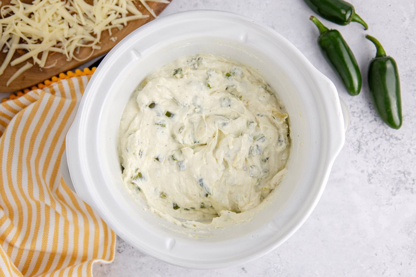 crockpot jalapeno popper dip in a slow cooker crock