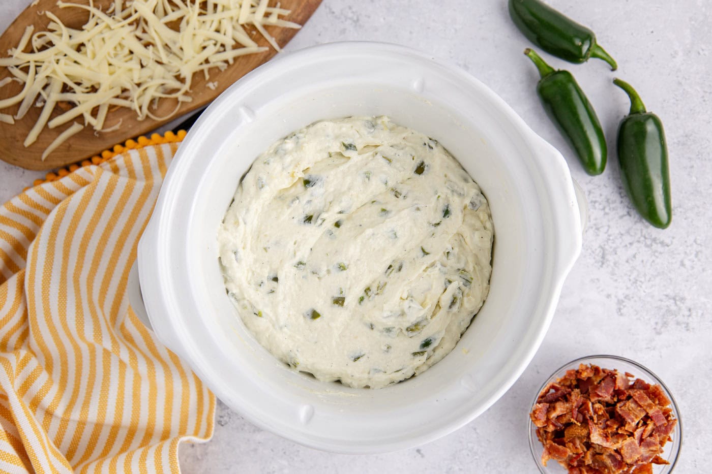 overhead of crockpot jalapeno popper dip in a slow cooker