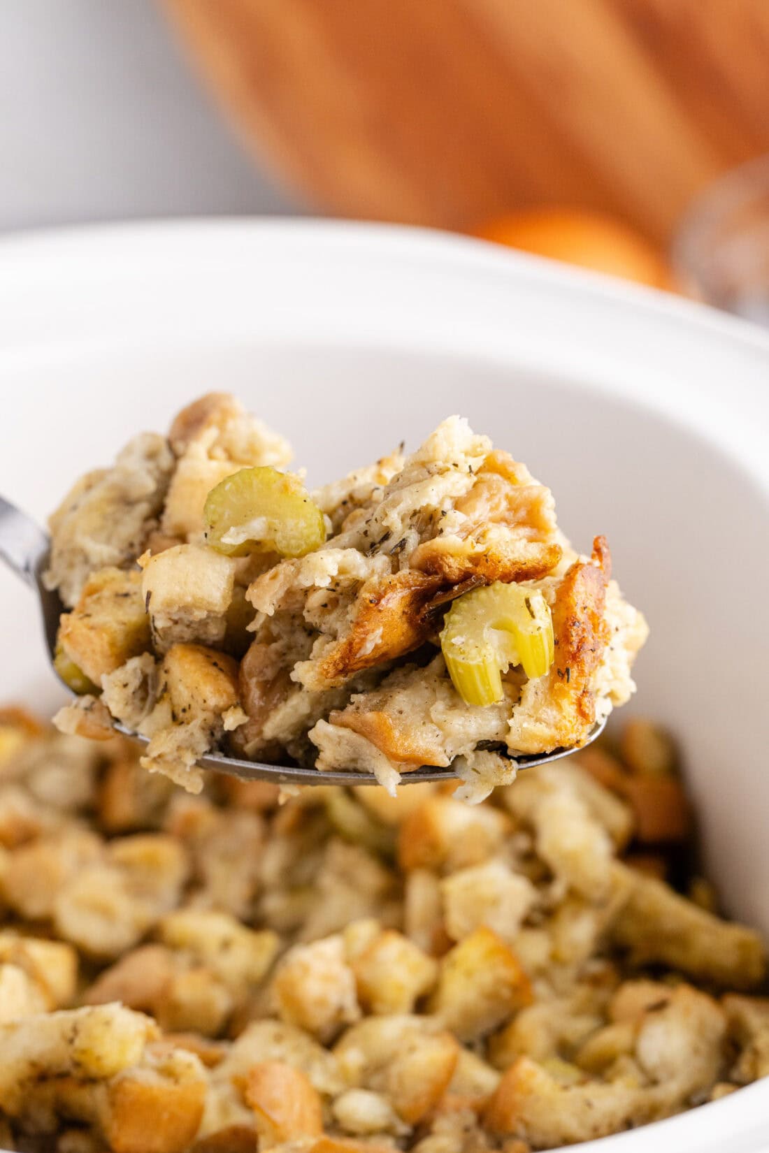 Close up photo of a spoonful of Crockpot Stuffing