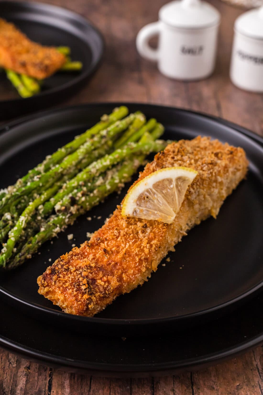 Crusted Salmon on a plate with asparagus 