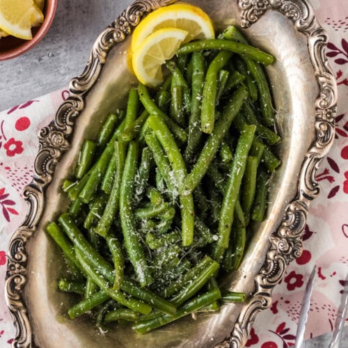 Instant Pot Green Beans in a metal platter topped with parmesan