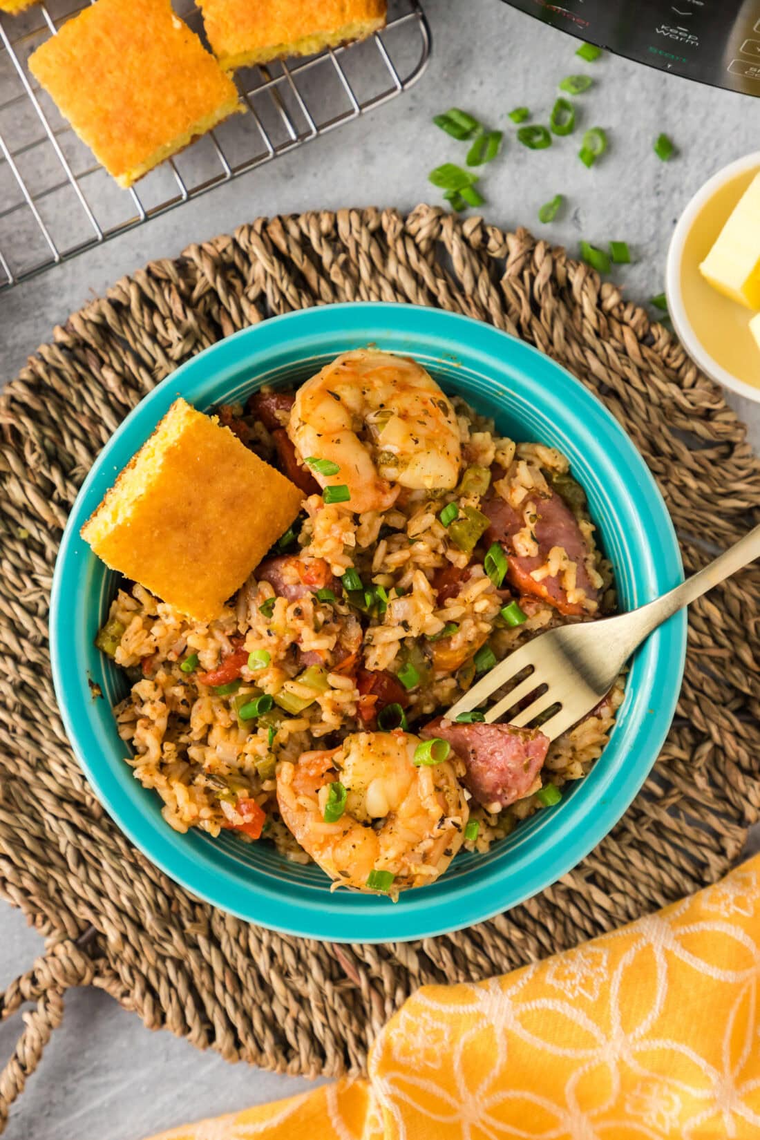 Bowl of Instant Pot Jambalaya with a fork resting on top