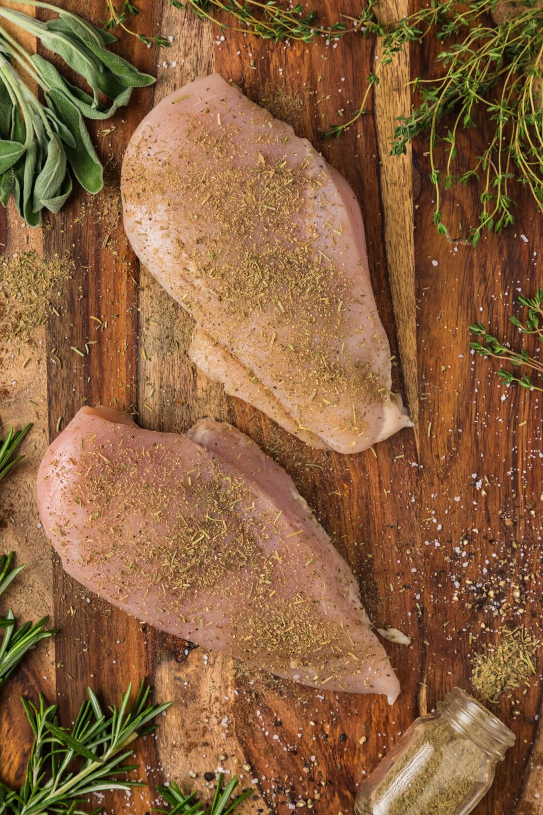 Raw chicken breasts coated in Poultry Seasoning