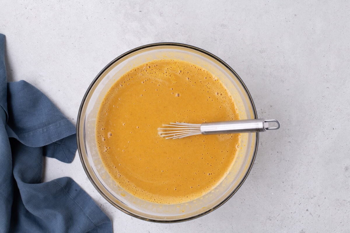 whisked pumpkin pie filling in a bowl