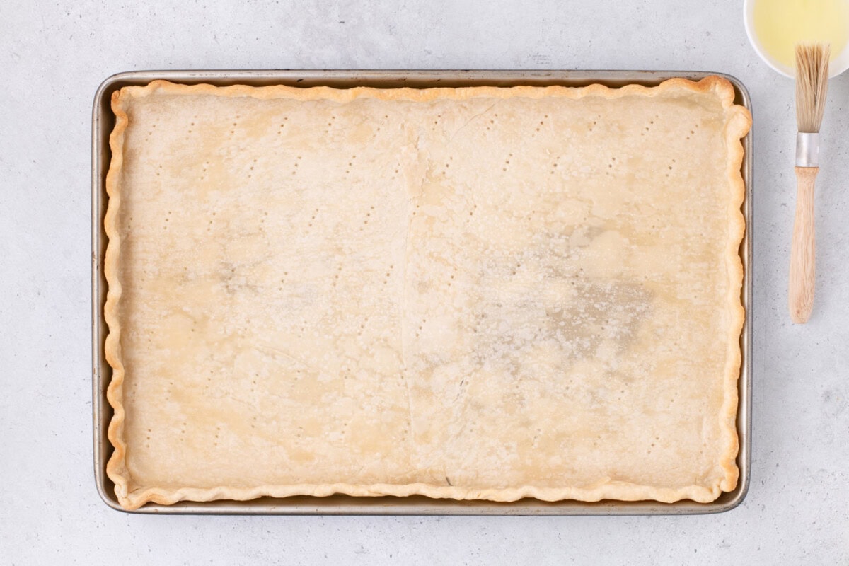 par baked pie crust in a jelly roll pan