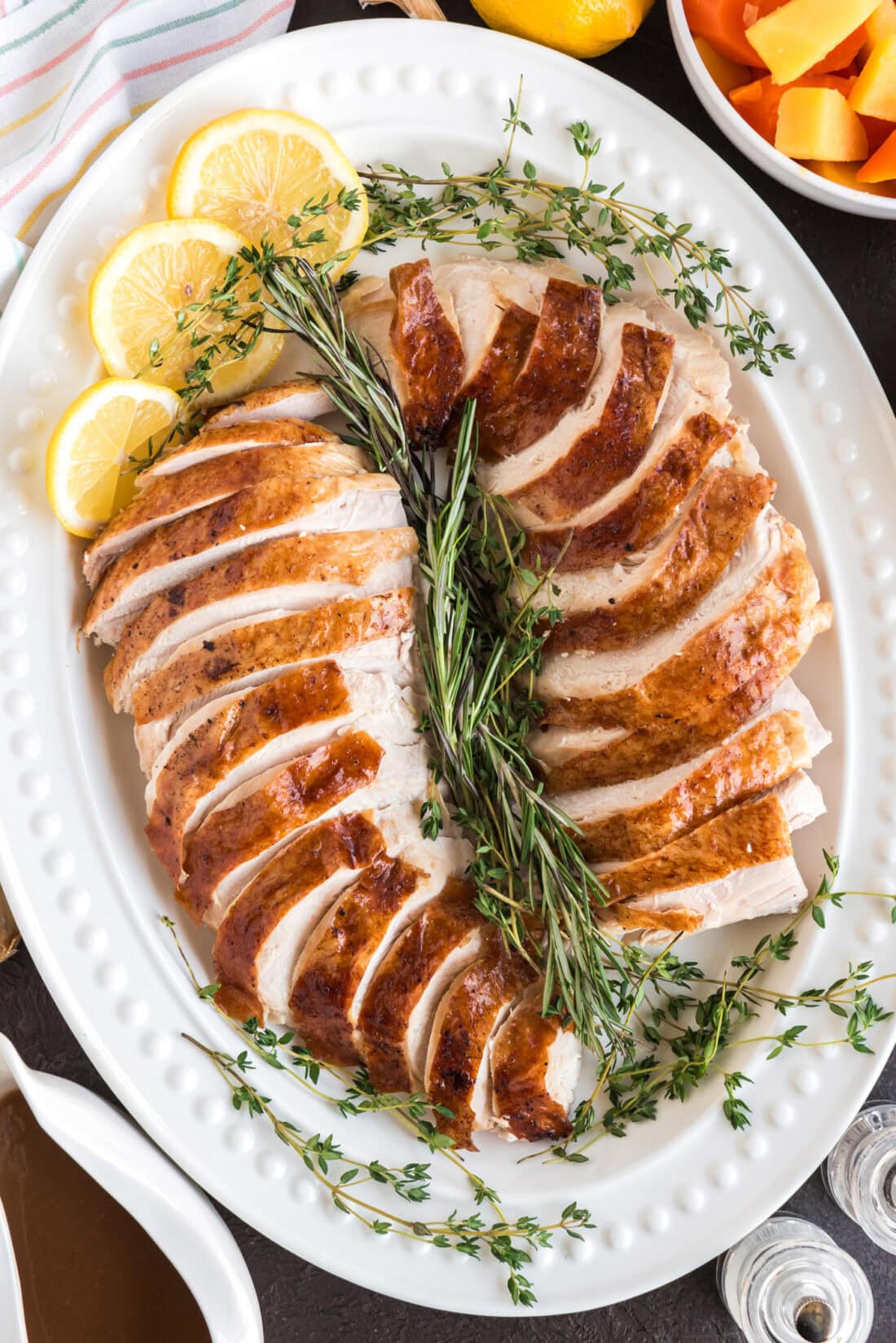 Sliced Roasted Turkey on a white serving platter