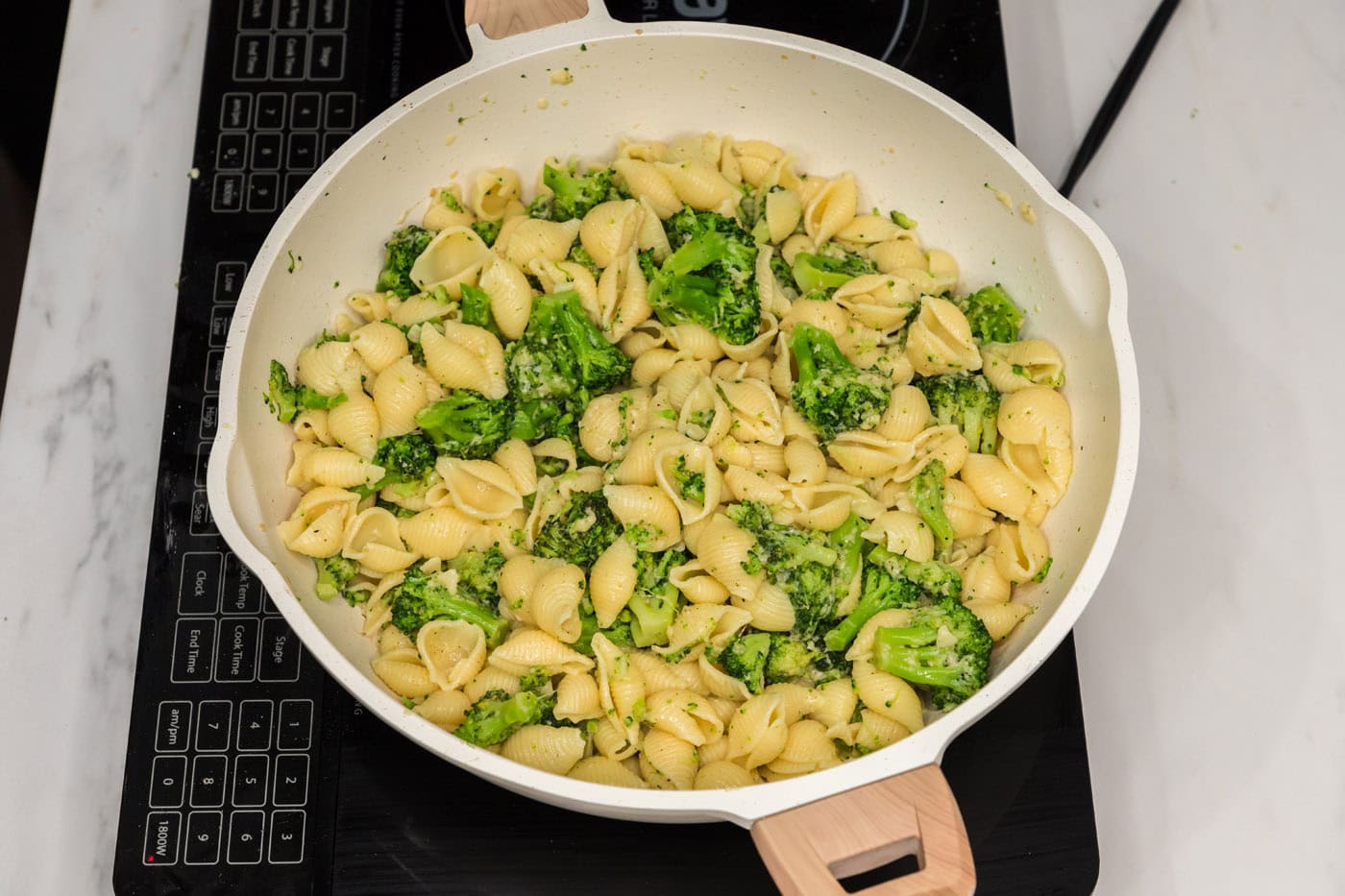 broccoli pasta with parmesan in a skillet