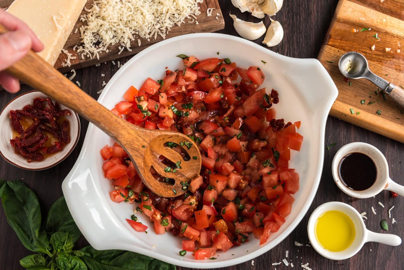 chopped tomatoes with basil, garlic, and balsamic vinegar in a bowl