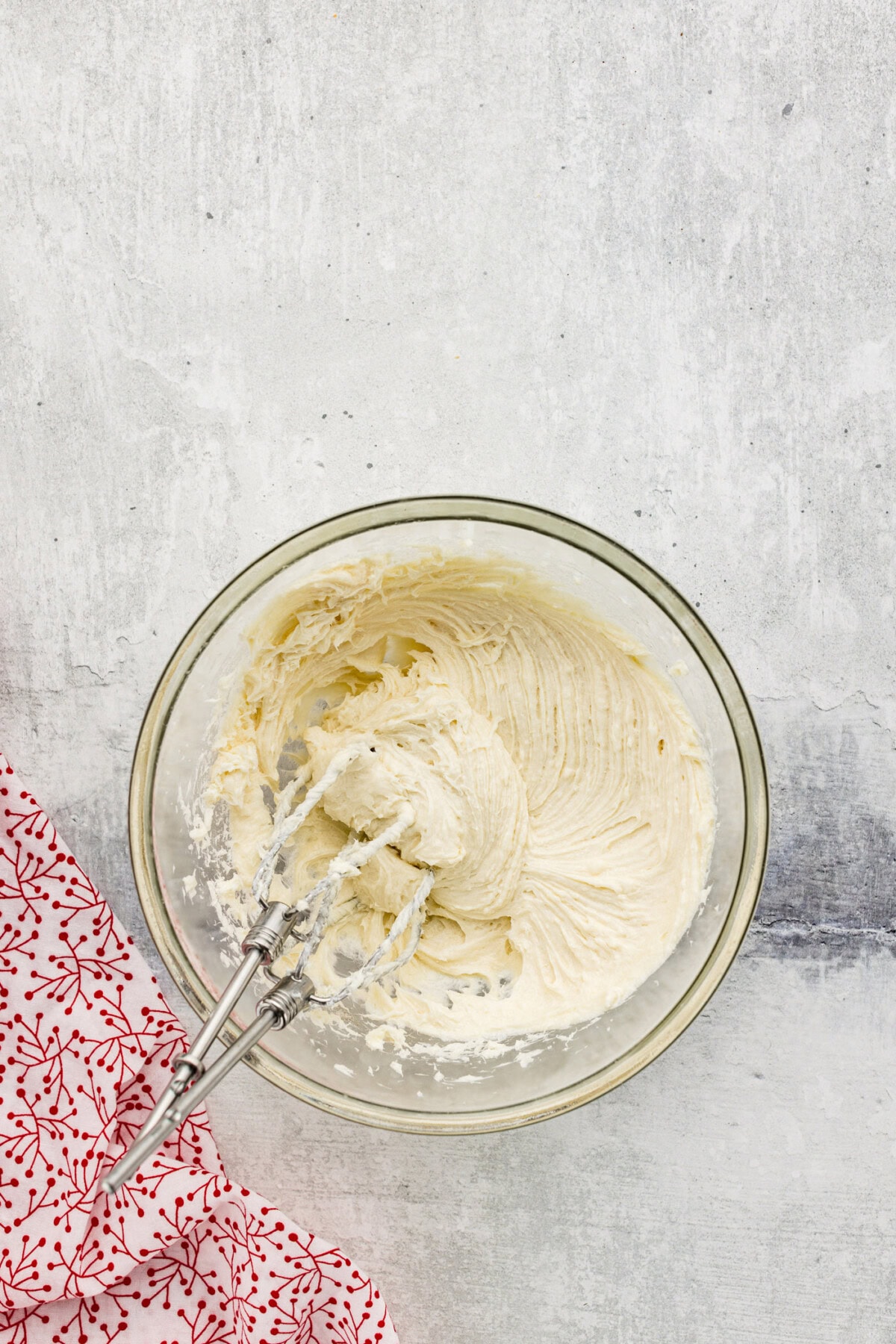cream cheese, sugar, and vanilla beaten with a hand mixer in a bowl