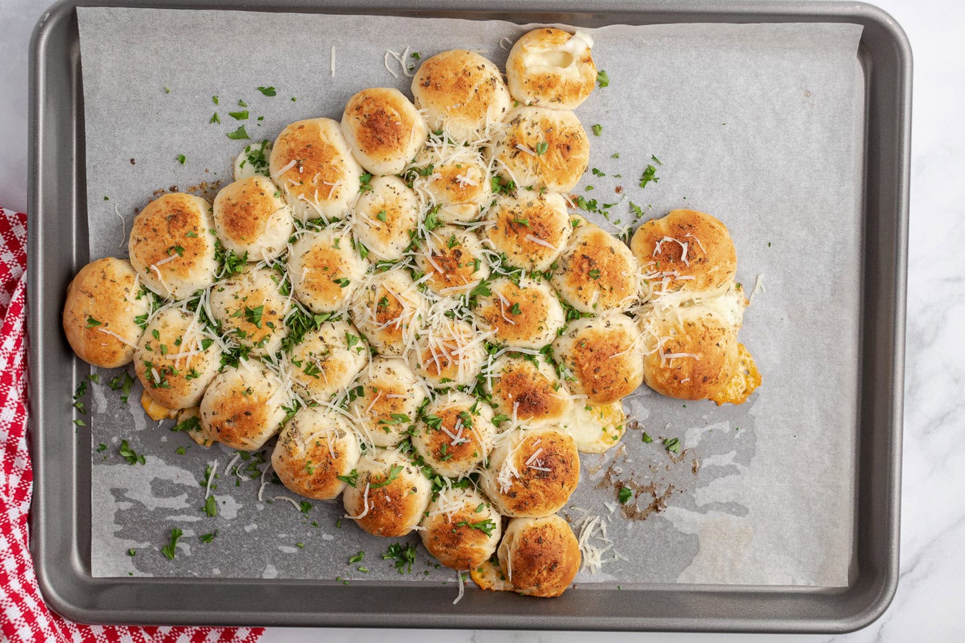 Christmas Tree Pull Apart Bread topped with fresh parsley and parmesan cheese