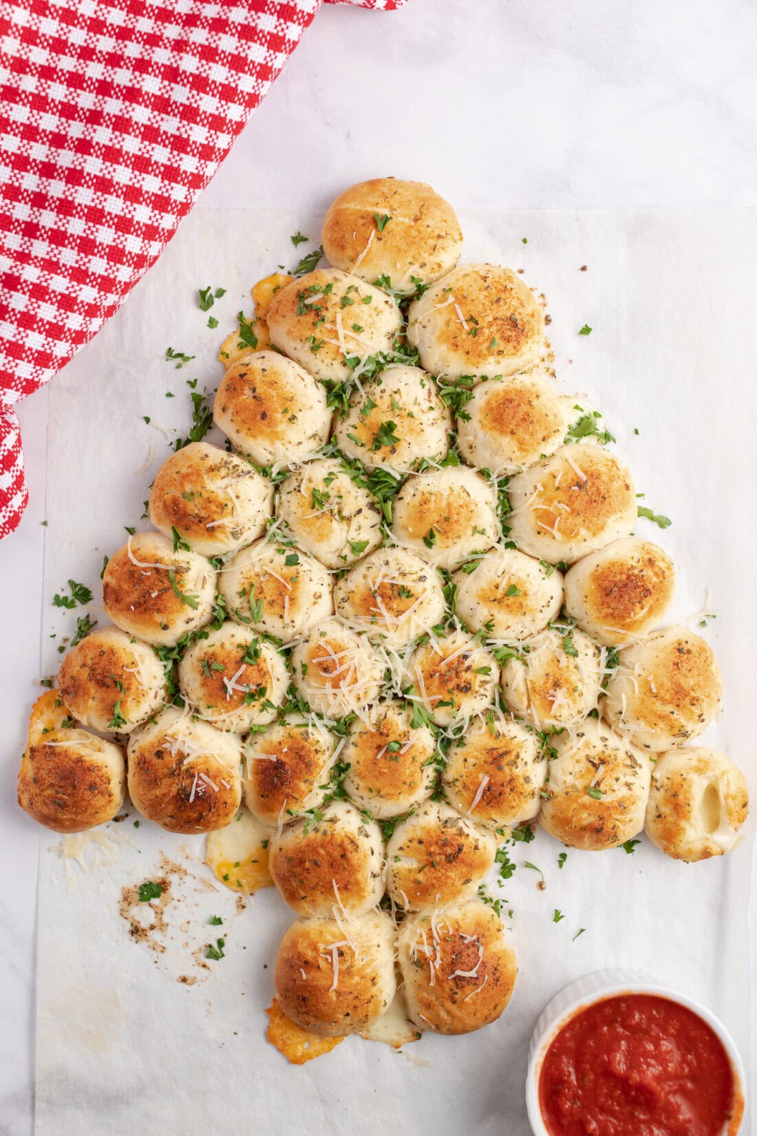 Christmas Tree Pull Apart Bread topped with fresh parsley and parmesan