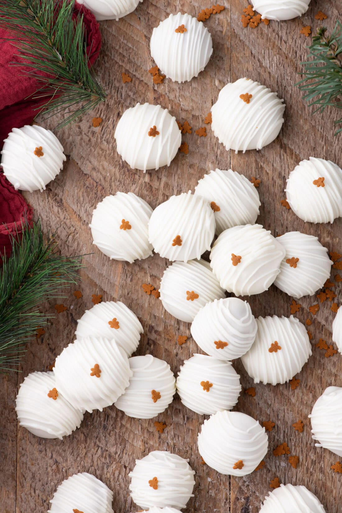 Gingerbread Oreo Truffles resting on a wood board