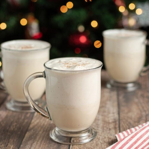 Close up photo of three mugs full of Homemade Eggnog