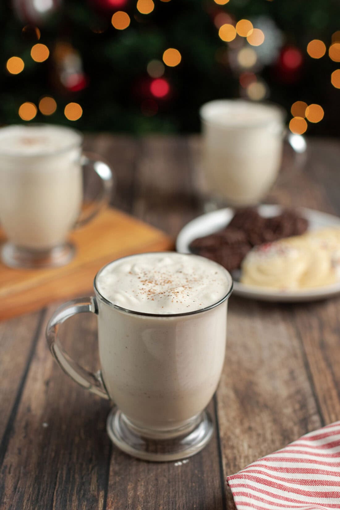 Mug of Homemade Eggnog with more behind it