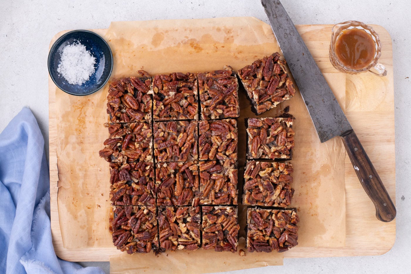 pecan pie brownies cut into squares on a baking sheet