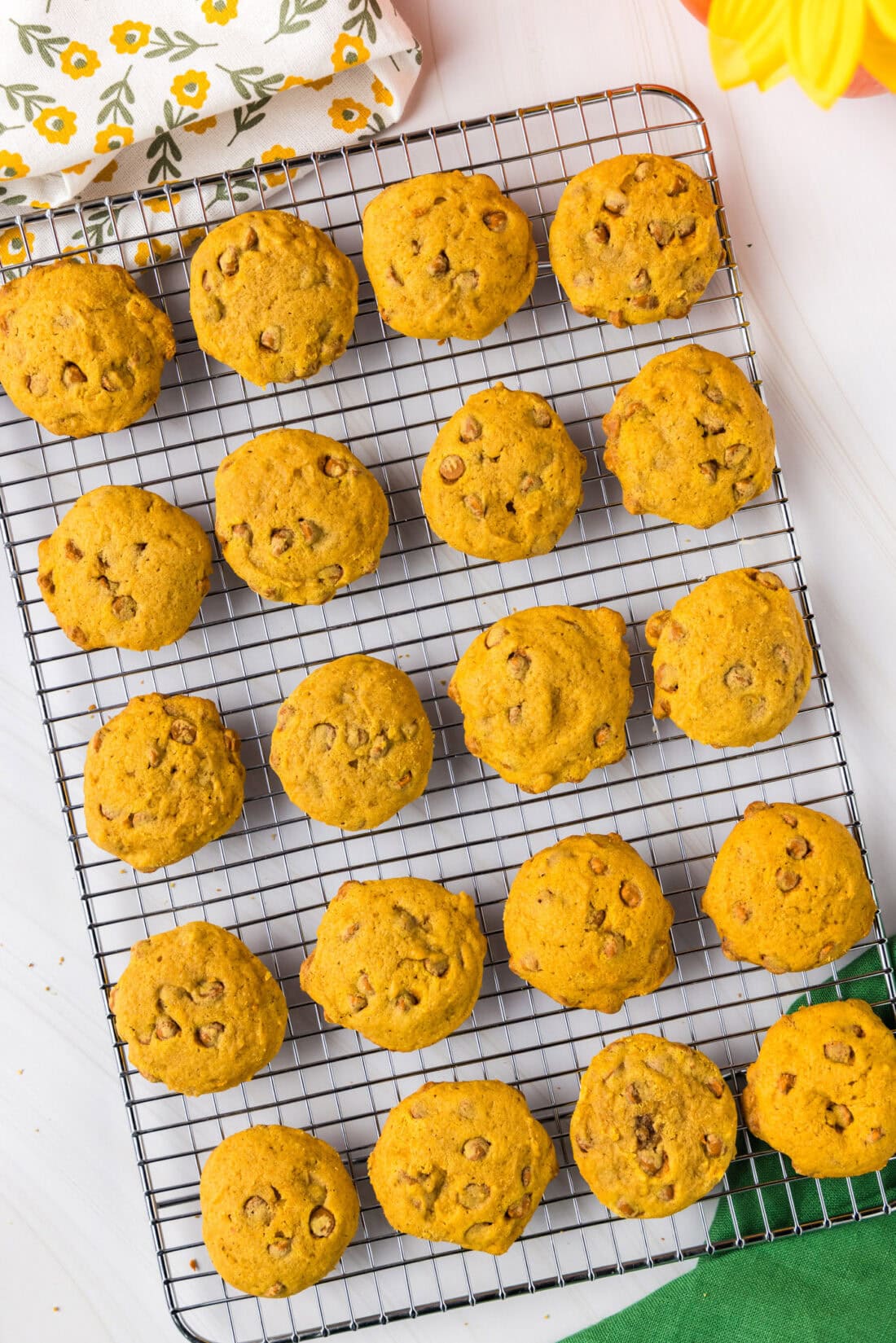 Pumpkin Cinnamon Chip Cookies resting on a wire rack