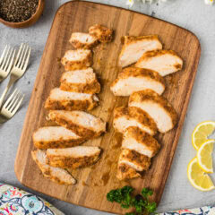 Sliced Sous Vide Chicken Breast served on a wooden platter