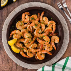 Plate of Steamed Shrimp with lemons on the side