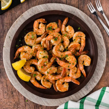 Plate of Steamed Shrimp with lemons on the side