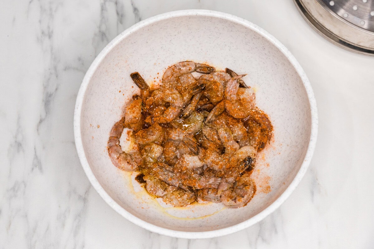 shrimp in a bowl with old bay seasoning