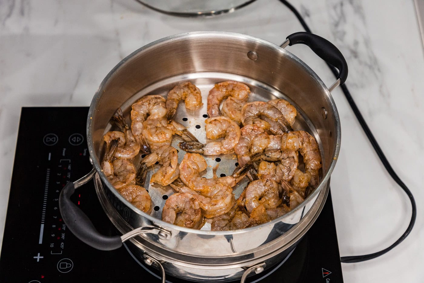 seasoned shrimp in a steamer pot