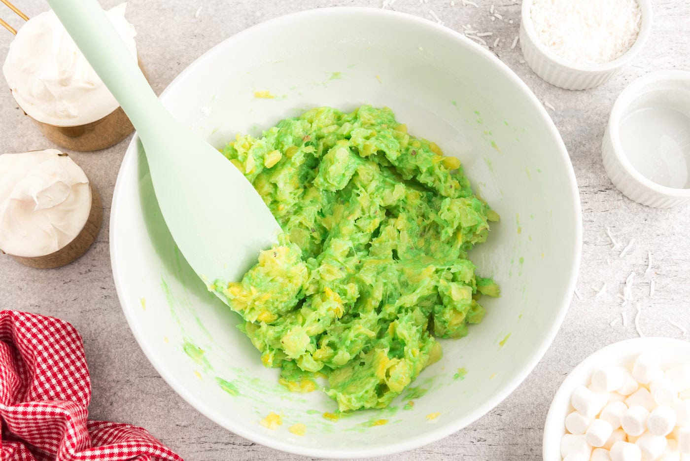 pistachio pudding mixed with crushed pineapple in a bowl