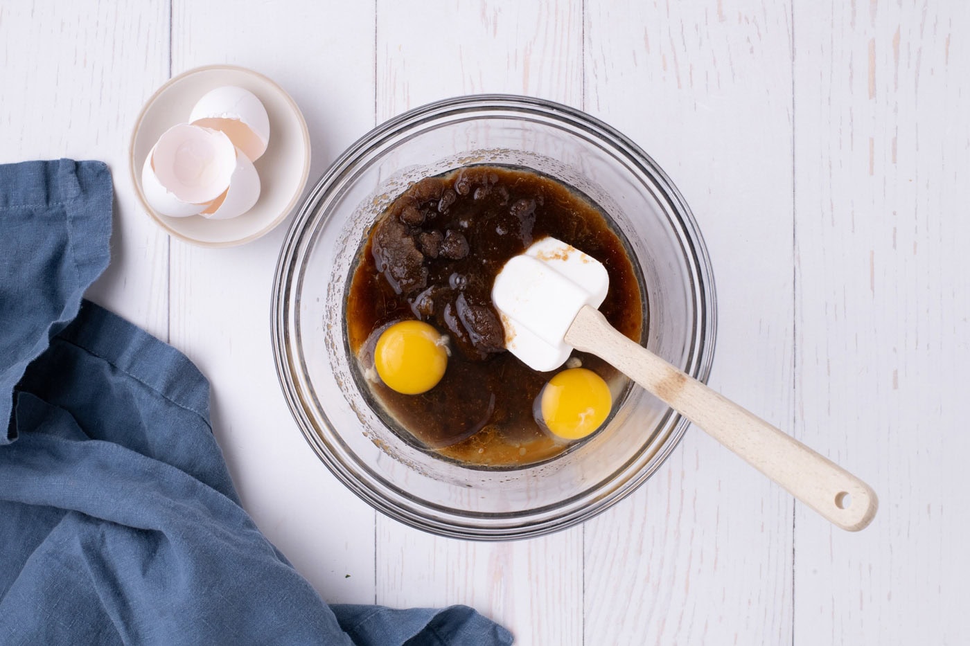 adding eggs to browned butter and sugar mixture